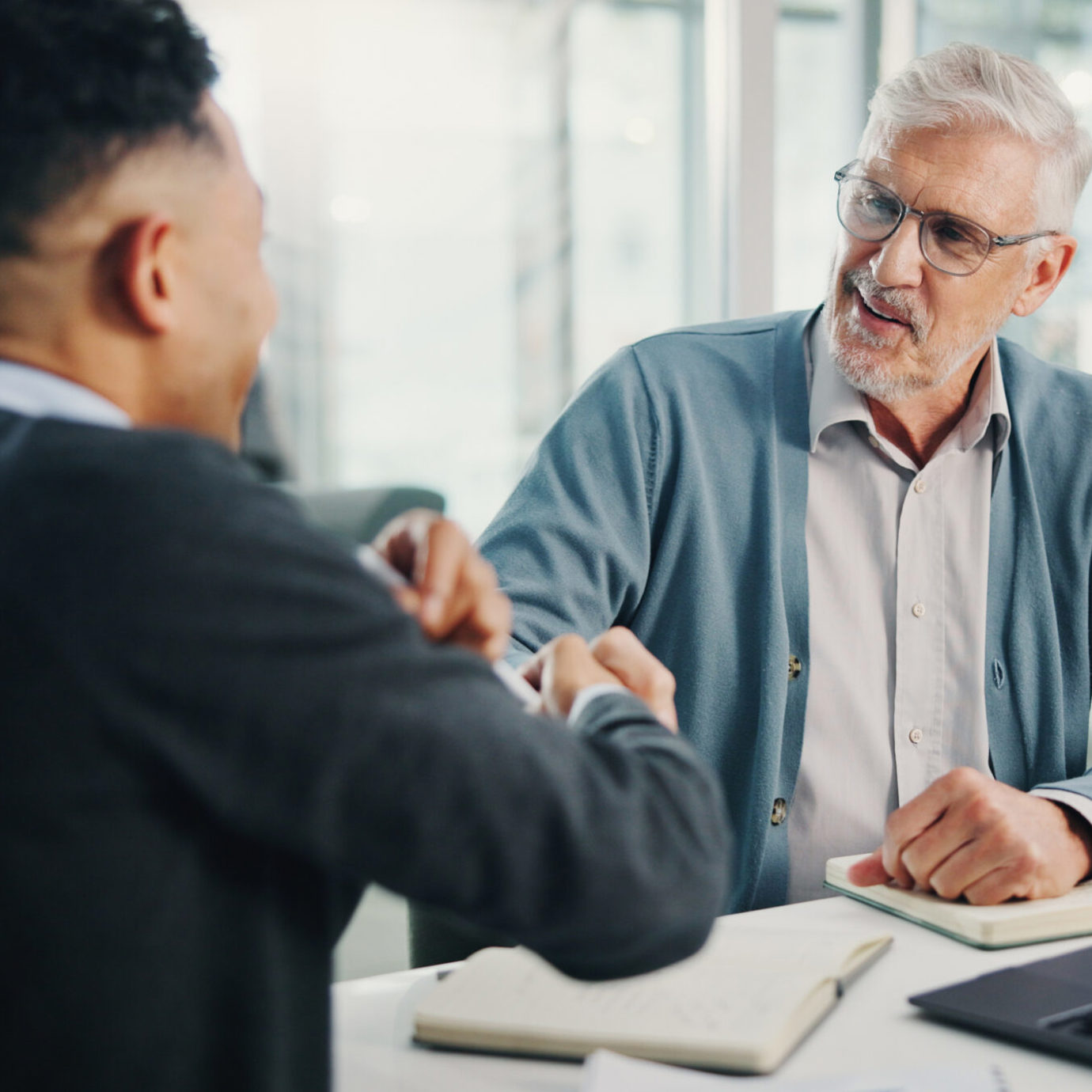 financial adviser and senior discussing pension options
