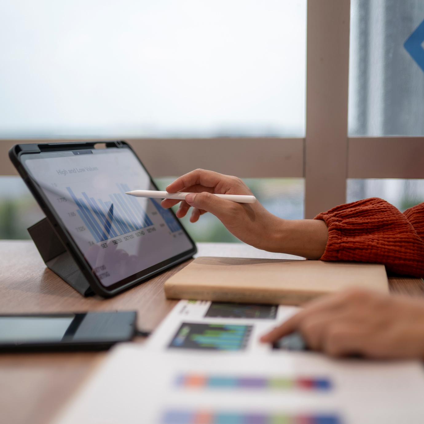 Woman reviewing Pension Allowances on iPad