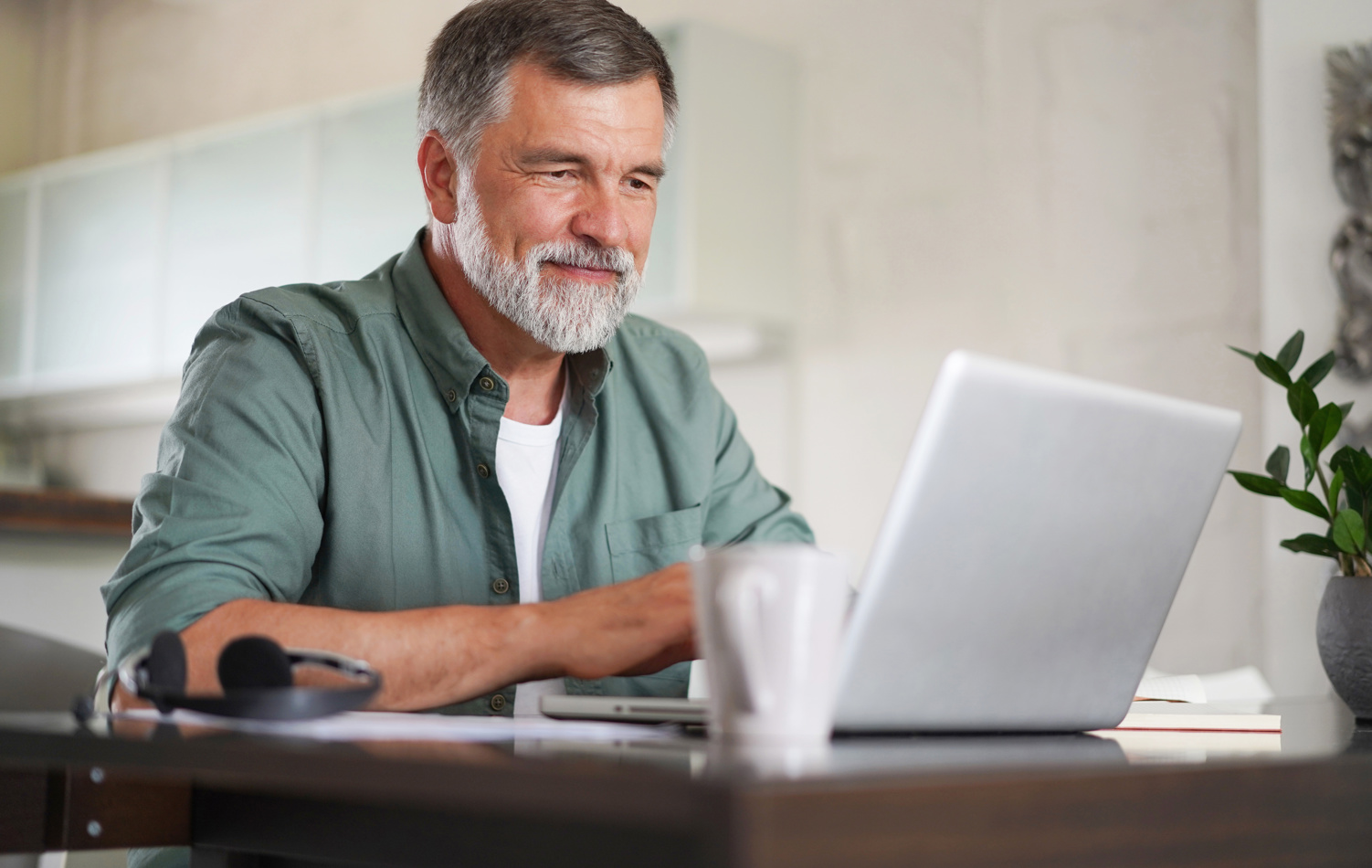 A man completing his online pension process 