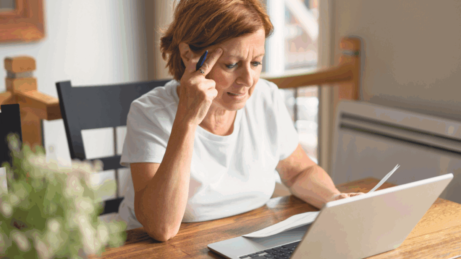 A woman reviewing her pension regularly