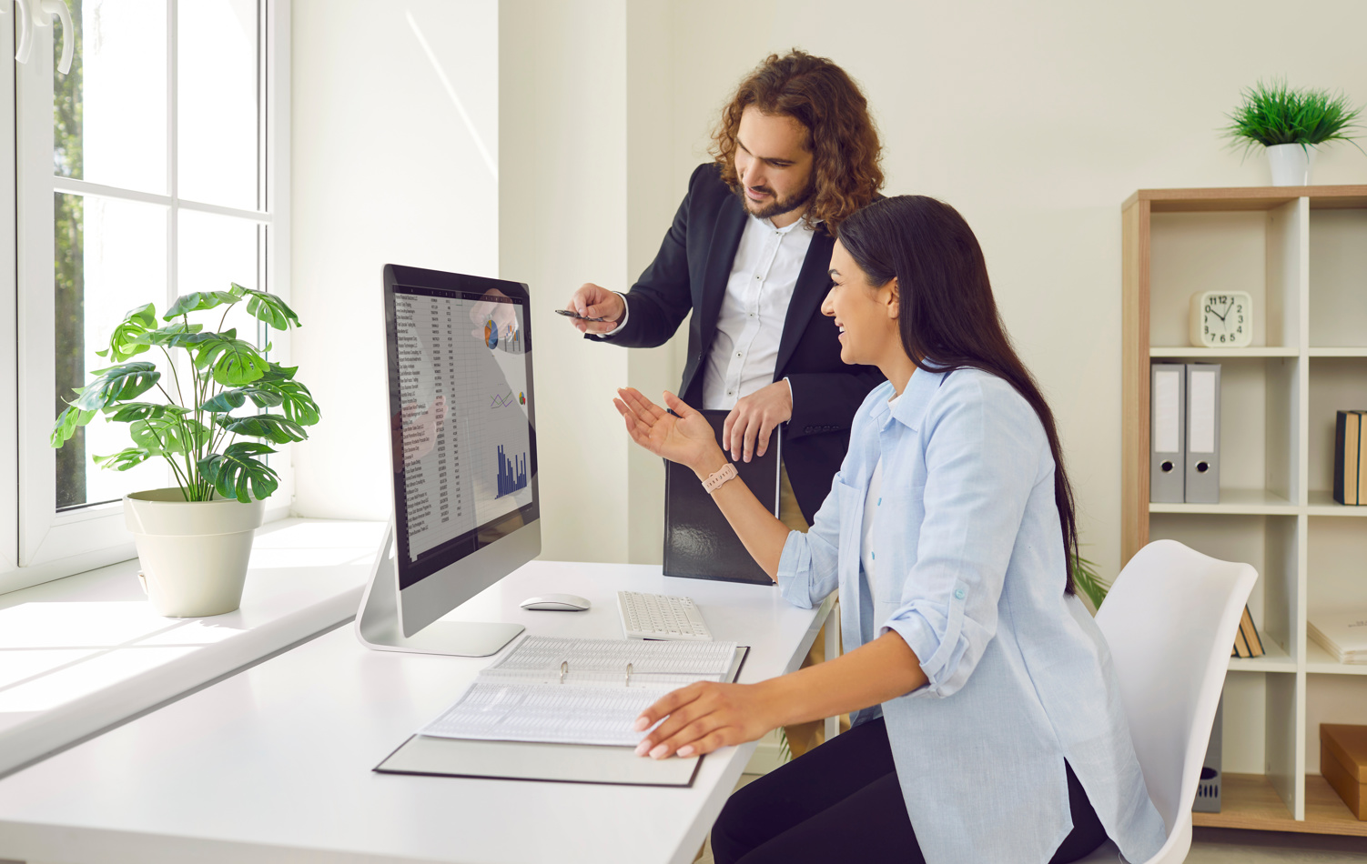 A man and woman looking at retirement plans 