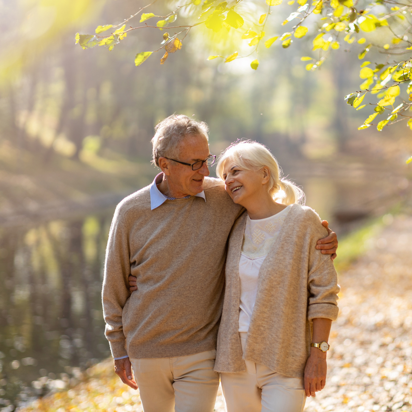 Senior couple walking down a trail  