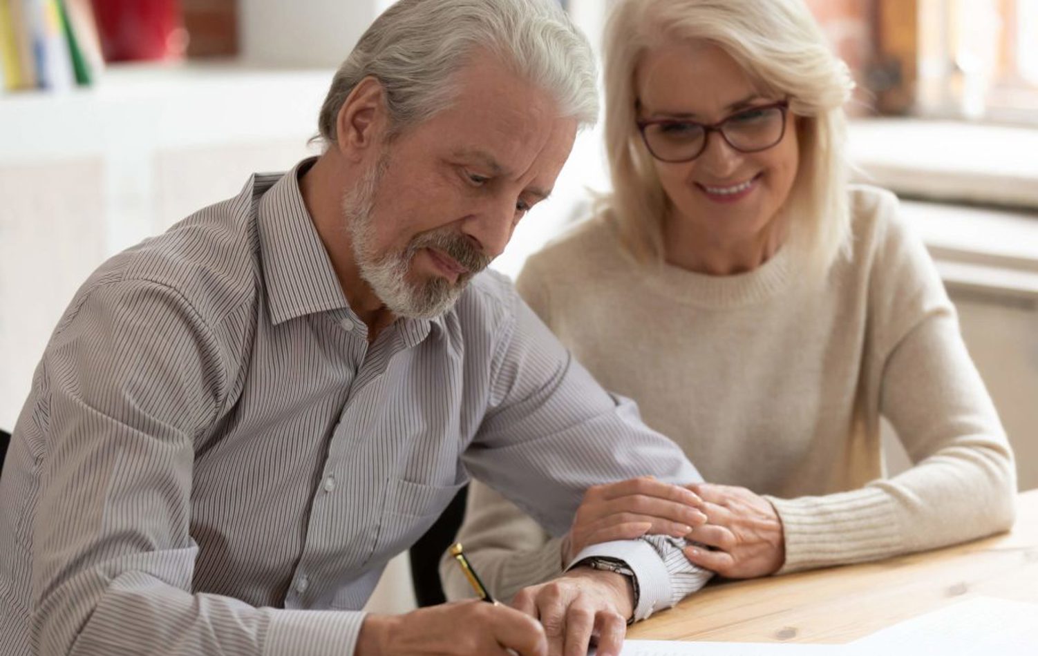 A couple writing a will 